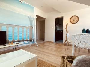 a living room with a view of the ocean at LA MARIEFACTURE - Comme un Poisson dans l'eau in Saint-Avold