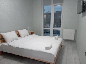Postel nebo postele na pokoji v ubytování AVALON Apart-Hotel