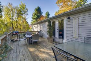 a patio with a table and chairs on a deck at Spacious Home 10 Miles to Wintergreen Resort! in Nellysford