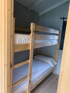 a couple of bunk beds in a room at Càmping Organyà Park in Organyà