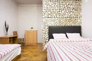 Łóżko lub łóżka w pokoju w obiekcie Apartamenty i Studia HERBARIUM
