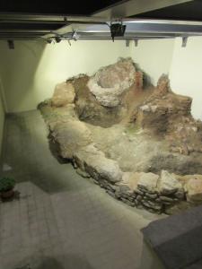 a museum with a large rock in a room at Kerameion in Athens