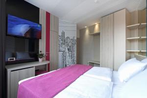 Letto o letti in una camera di Hotel Cosmopolit