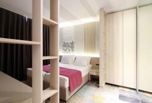 Letto o letti in una camera di Hotel Cosmopolit