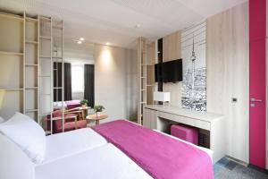 Letto o letti in una camera di Hotel Cosmopolit
