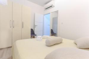 Ένα ή περισσότερα κρεβάτια σε δωμάτιο στο Villa Capitis in the center-Deluxe Apartment with Swimming Pool +32 φωτογραφίες