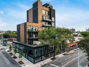 an architectural rendering of a tall building on a city street at The Bogart by LuxUrban, Trademark Collection by Wyndham in Brooklyn