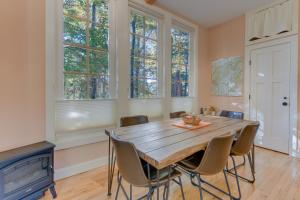 a dining room with a wooden table and chairs at WNC French Broad RiverWalk Retreat with WiFi in Hot Springs