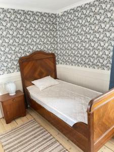 a small bedroom with a bed and a table at MoraTelegrafen in central Mora in Mora