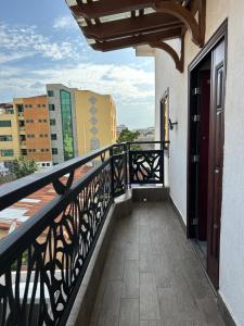 a balcony with a view of a city at 2-Bedroom Flat by PanAfri Homes in Accra