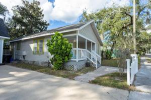 a small white house with a white porch at 1940 cottage seen on FYI, 2bd 2ba in Gainesville