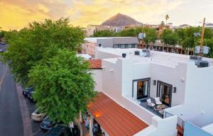 an aerial view of a building with a mountain in the background at Live Above Shops and Restaurants in Oldtown Scottsdale in Scottsdale