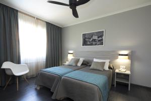 Een bed of bedden in een kamer bij Hotel Combarro