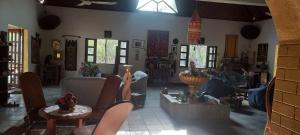 a living room with a person laying on a couch at Villa Befasika in Toliara