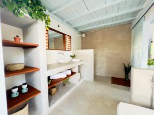 a bathroom with a sink and a mirror at Casa Celeste in Atins +17 photos