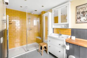 a bathroom with a sink and a shower at City Height's - Rooftop Garden! Ginger & Gold in Norwich