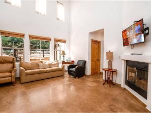 a living room with a couch and a fireplace at El Dorado Ranch Vacation Rental Condo 21-1 in San Felipe