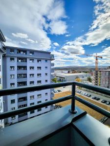 a balcony with a view of a building at OOTA Soko Ha in Kragujevac