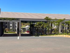 an empty parking lot in front of a building at Ultra Modern Apartment - Self Catering in Ballito
