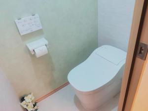 a bathroom with a toilet and a roll of toilet paper at SY Mansion - Vacation STAY 15495 in Saitama