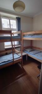 a dorm room with four bunk beds in it at Hostel ALEX&TSA in Kraków