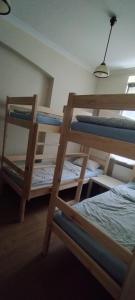 a bedroom with two bunk beds in a room at Hostel ALEX&TSA in Krakow