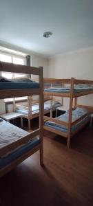 a group of bunk beds in a room at Hostel ALEX&TSA in Krakow