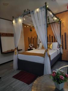 Postel nebo postele na pokoji v ubytování PH BOUTIQUE HOTEL Girardot