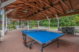 a ping pong table on a patio at Indoor Pool Near Grand Haven & Lake Michigan Beach in Spring Lake