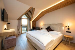 Postel nebo postele na pokoji v ubytování myLoisl Apartments