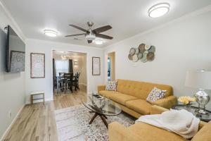 a living room with a couch and a table at W 21st In The Heights in Houston