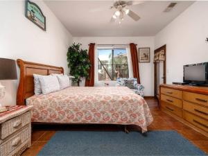 a bedroom with a bed and a flat screen tv at El Dorado Ranch San Felipe Rental Condo 57-2 in San Felipe +25 photos