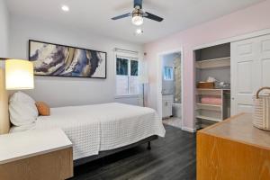a bedroom with a bed and a ceiling fan at Lovely North Hollywood House Near Universal in North Hollywood