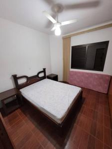 Ένα ή περισσότερα κρεβάτια σε δωμάτιο στο Pérola de águas de Lindóia