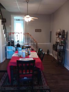 a dining room with a table with a red table cloth at Cozy Suburban Nest in Hopewell