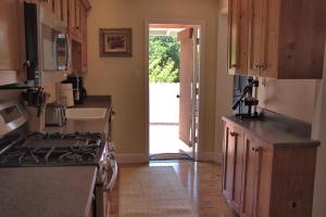 a kitchen with a stove top oven next to a door at 1801 Downing Ave. in Cambria