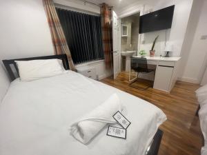 Postel nebo postele na pokoji v ubytování Tarleton Guesthouse