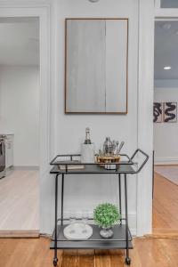 a table with a plant on it in a room at The Palmetto House B- Walk To King Street in Charleston