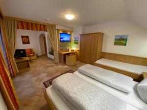 Łóżko lub łóżka w pokoju w obiekcie Hotel Garni Gafluna