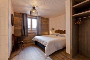 Ένα ή περισσότερα κρεβάτια σε δωμάτιο στο Lodge 10 personnes proche pistes et commerces belle vue