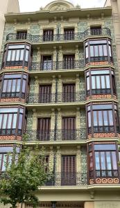 a tall building with balconies on the side of it at ESPOLON LUXURY 10 in Logroño