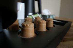 a group of brown objects sitting on top of a stove at Hotel Mosaic City Centre in Amsterdam