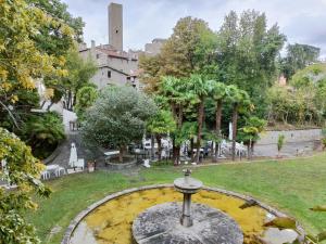 a fountain in the middle of a park at Il Paradosso Suite in Viterbo