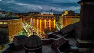 a view of a city at night with traffic at Radisson Blu GHR Rome in Rome