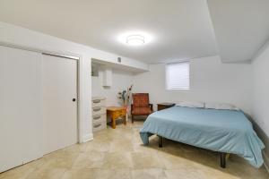 a bedroom with a bed and a chair at Park Ridge Vacation Rental 17 Mi to Chicago in Park Ridge