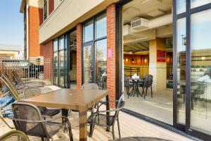 a patio with a wooden table and chairs at Drury Inn & Suites St. Louis St. Peters in Saint Peters