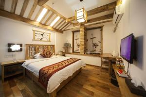 Postelja oz. postelje v sobi nastanitve Zhangjiajie Wangyi Inn