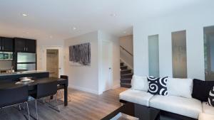 a living room with a couch and a table at Gables 25 - Luxury Townhouse! Walk Everywhere in 5 mins - Whistler Platinum in Whistler