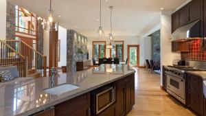 a kitchen with a sink and a counter top at Kadenwood 2972 - Mountain Chalet, w/ Hot Tub, Pool Table, Fireplace - Whistler Platinum in Whistler