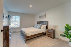 a bedroom with a bed and a window at Nature Immersion Tranquil 2-BR Gem Auburn, ME, 2BD, 1BA with Free Parking & WiFi in Auburn